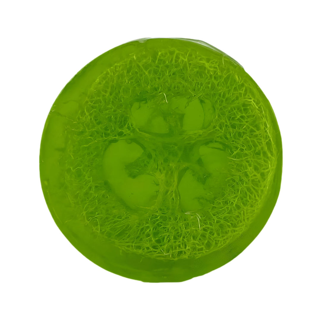 Round, translucent green glycerin soap bar embedded with a natural loofah slice, showing the loofah&