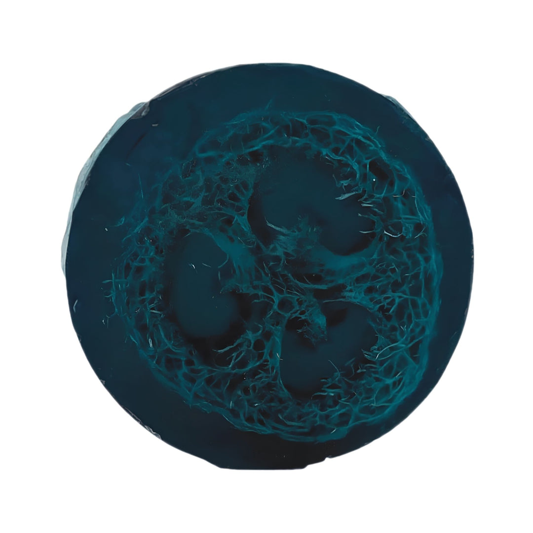 Blueberry Bliss Loofah Soap with a natural exfoliating loofah center and deep blue-purple color on a white background.