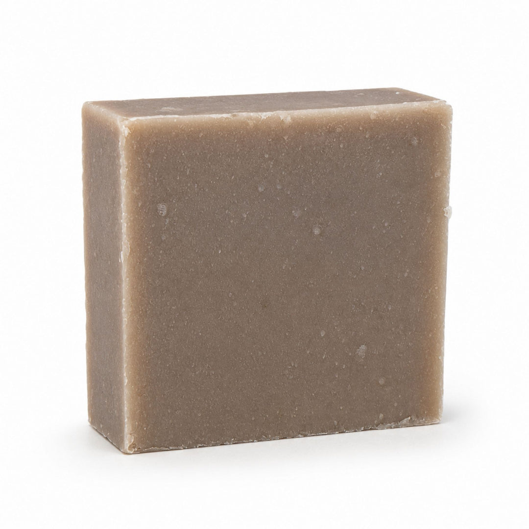 Dirty Bee Choco Choco Milk Soap Bar, a square matte taupe-brown textured soap bar, on a white background.