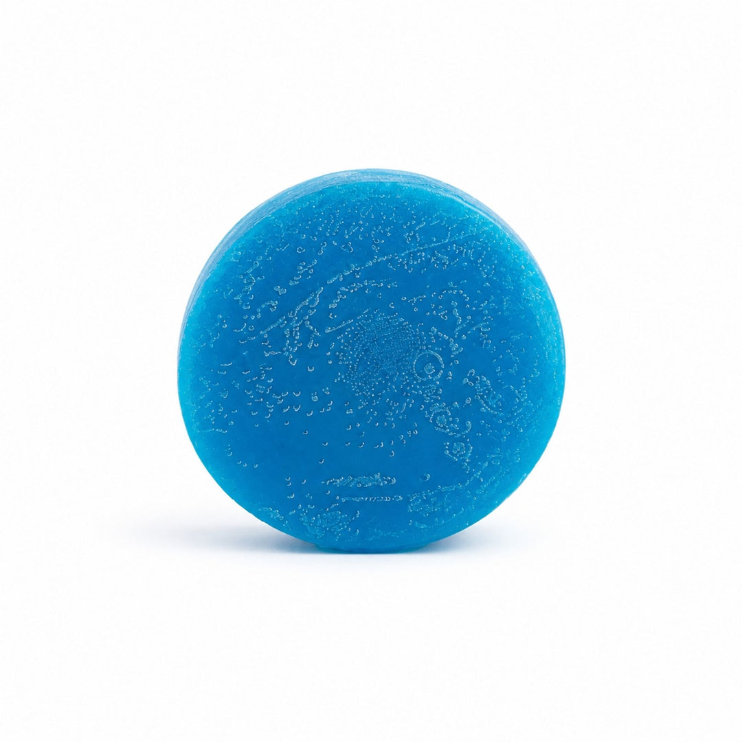 Dirty Bee Galactic Skies Conditioner Bar, a round bright blue bar with a swirled marbled pattern on a clean white background.