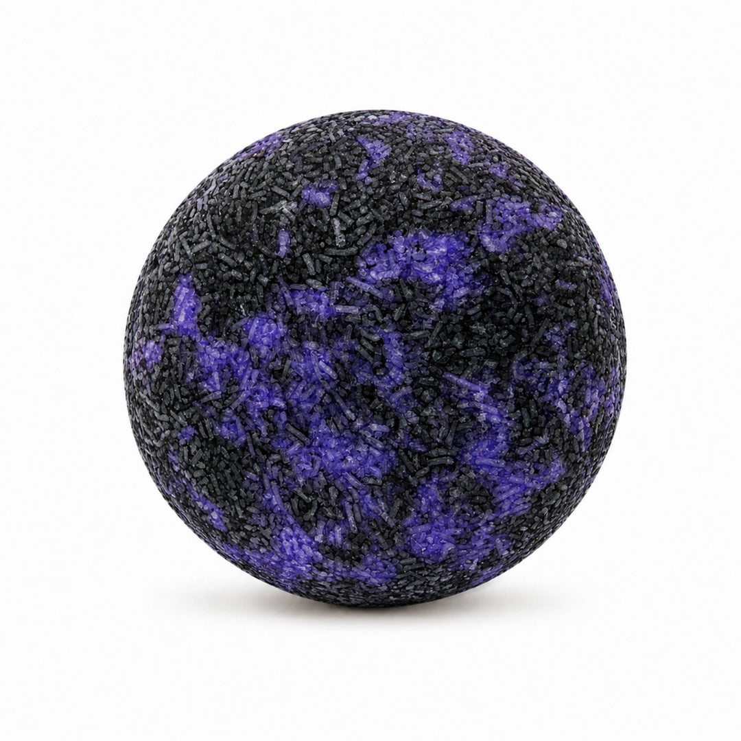 Dirty Bee Galactic Skies Shampoo Bar, a round textured shampoo bar with a black and purple marbled pattern, on a white background.