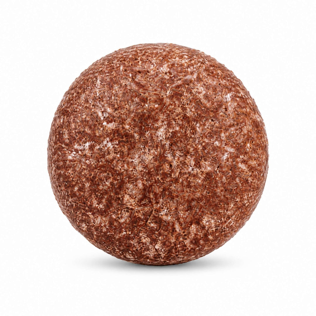 Dirty Bee Lavender Vanilla Shampoo Bar, a round textured shampoo bar in rust-brown and beige, on a white background.