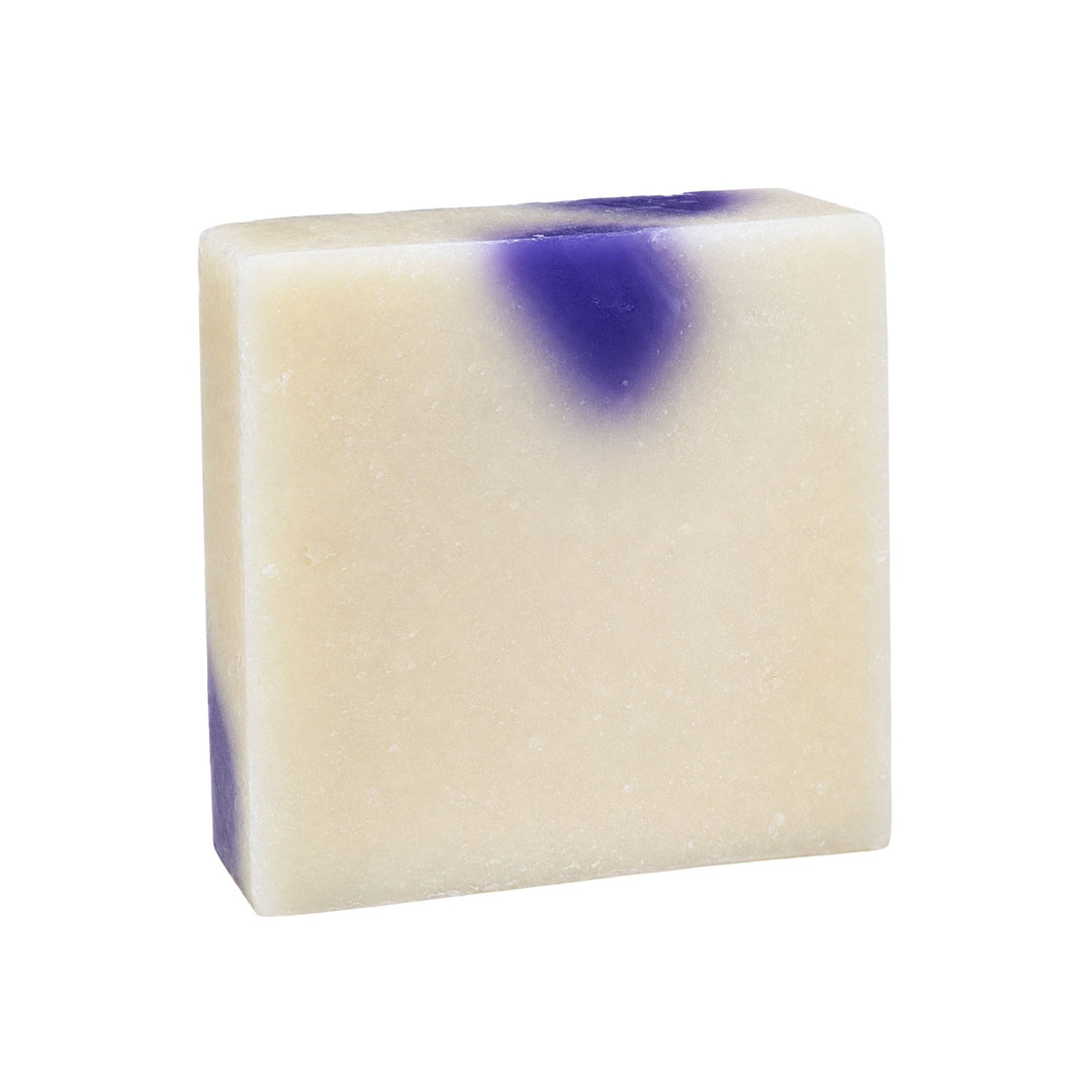 Midnight Berry soap bar in creamy ivory with a deep purple accent and handmade texture on a white background.