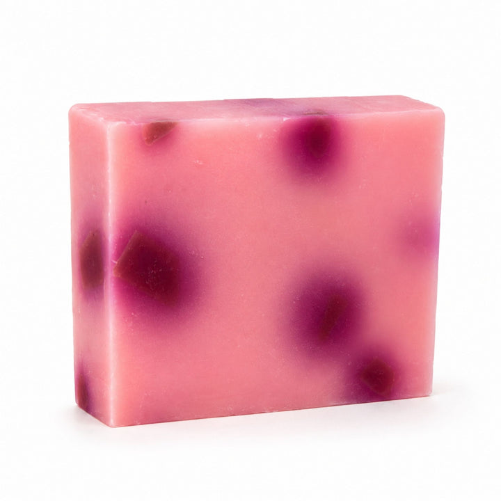 Dirty Bee Ring Around The Rosie Soap Bar, a square pink soap bar with dark magenta spots, on a white background.