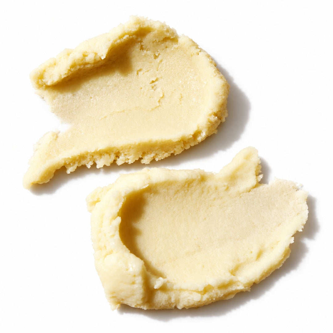 Close-up of creamy shea butter on a white background