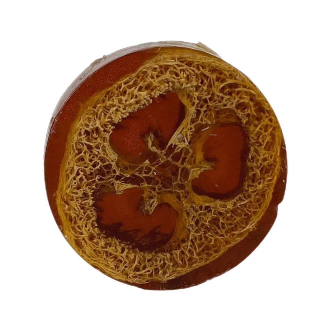 Velvet Sandalwood Loofah Soap with a natural exfoliating loofah texture and brown color on a white background.