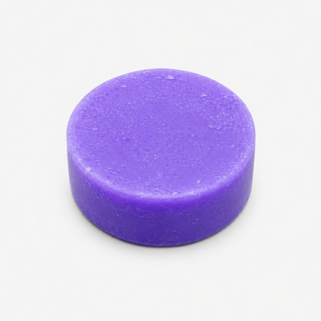 Dirty Bee Blondie Purple Conditioner Bar, a round violet solid conditioner bar on a clean white background.