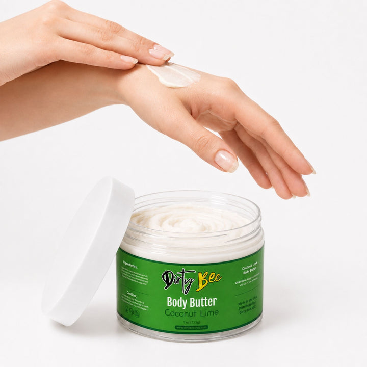 Dirty Bee Coconut Lime Body Butter with hands applying the creamy moisturizer on a white background.