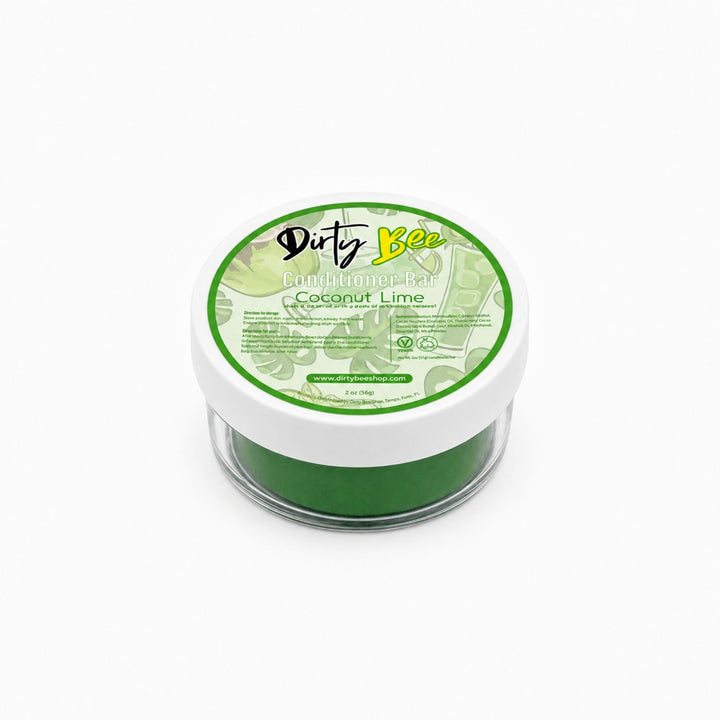 Dirty Bee Coconut Lime conditioner bar in a round clear jar with a white lid, centered on a clean white background.