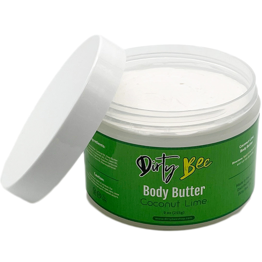 Dirty Bee Coconut Lime Body Butter in an open clear jar with white lid on a white background.